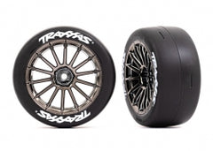 Traxxas: Tires & wheels, assembled, glued (multi-spoke black chrome wheels, 2.0" slick tires with Traxxas® logo, foam inserts) (front) (2) (VXL rated) (9347R)